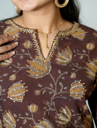 Hand Block Printed Side Kali Kurta Embellished With Hand Embroidery and sequin detail.